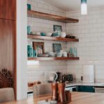 A table and shelves in a kitchen