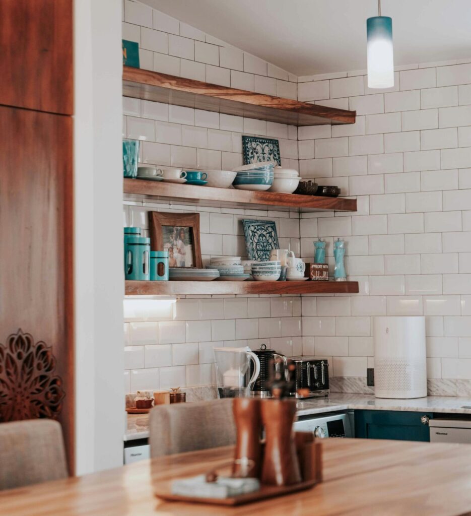 A table and shelves in a kitchen