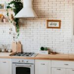 Chopping boards on a wooden countertop with white cabinets