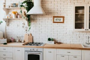 Chopping boards on a wooden countertop with white cabinets