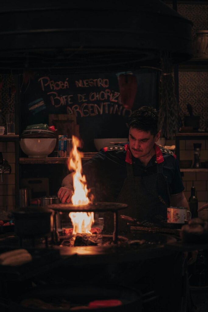 A man cooking at a bar