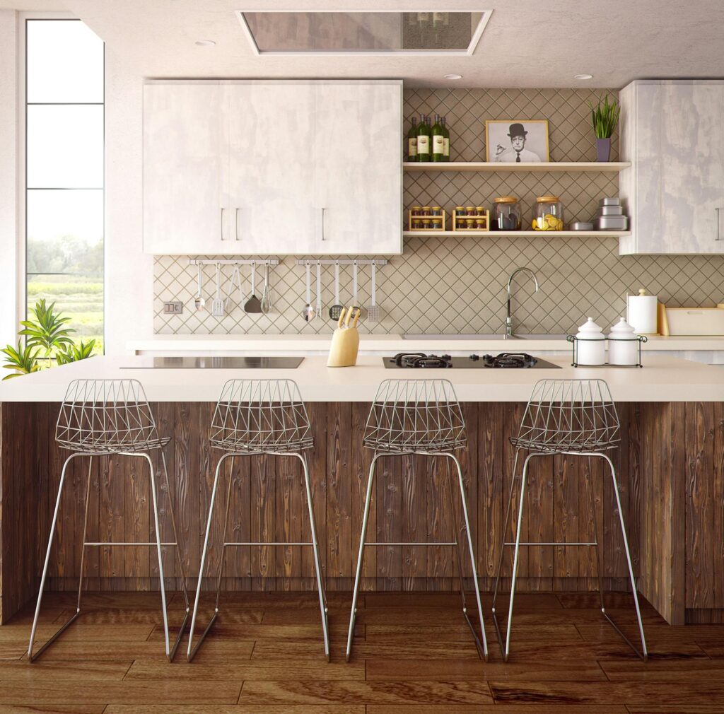 Four gray stools in front of a kitchen countertop