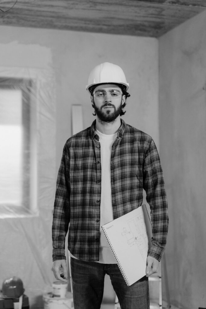 A man wearing a white hard hat