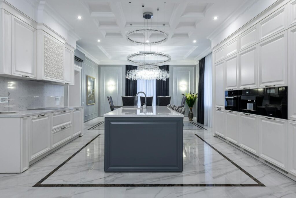 A modern spacious kitchen with light furniture