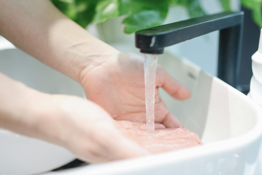 A person washing their hands