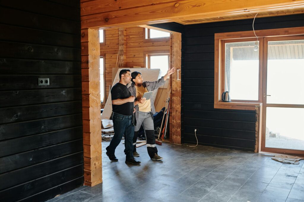 Two people checking on a construction project