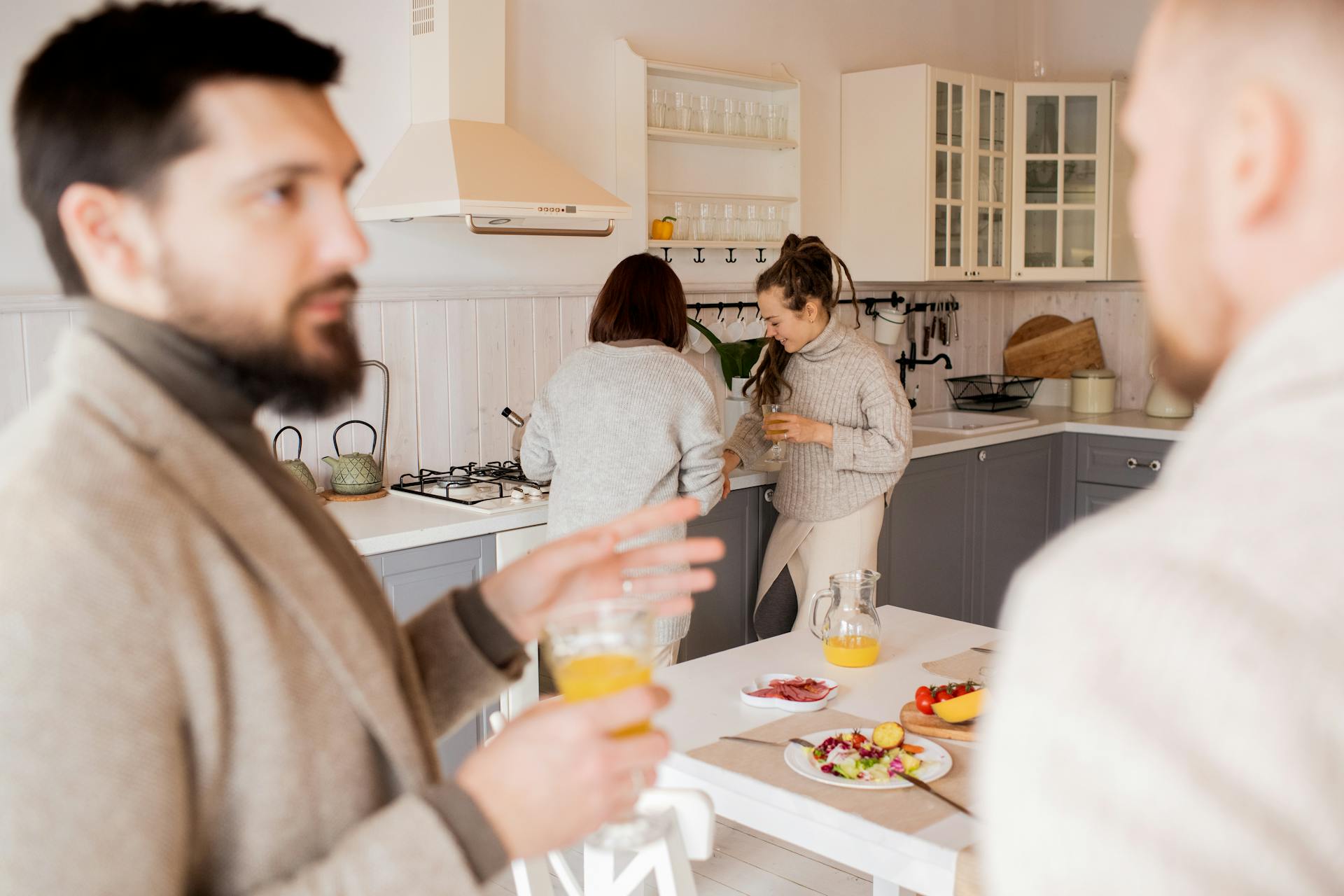 People hanging out in renovated kitchen