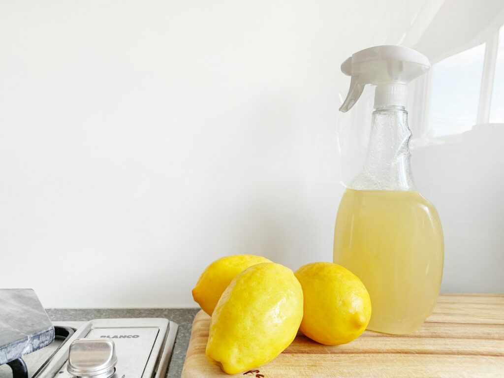 Lemons and spray bottle on the kitchen countertop