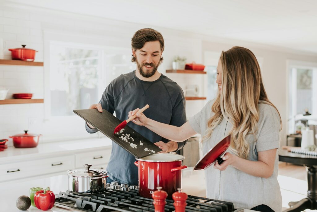 Couple preparing food in modern kitchen