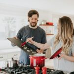 Couple preparing food in modern kitchen