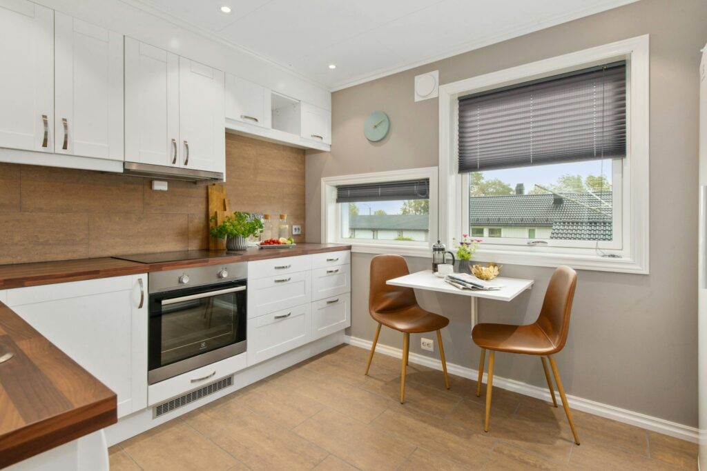 Modern kitchen with small table and chairs